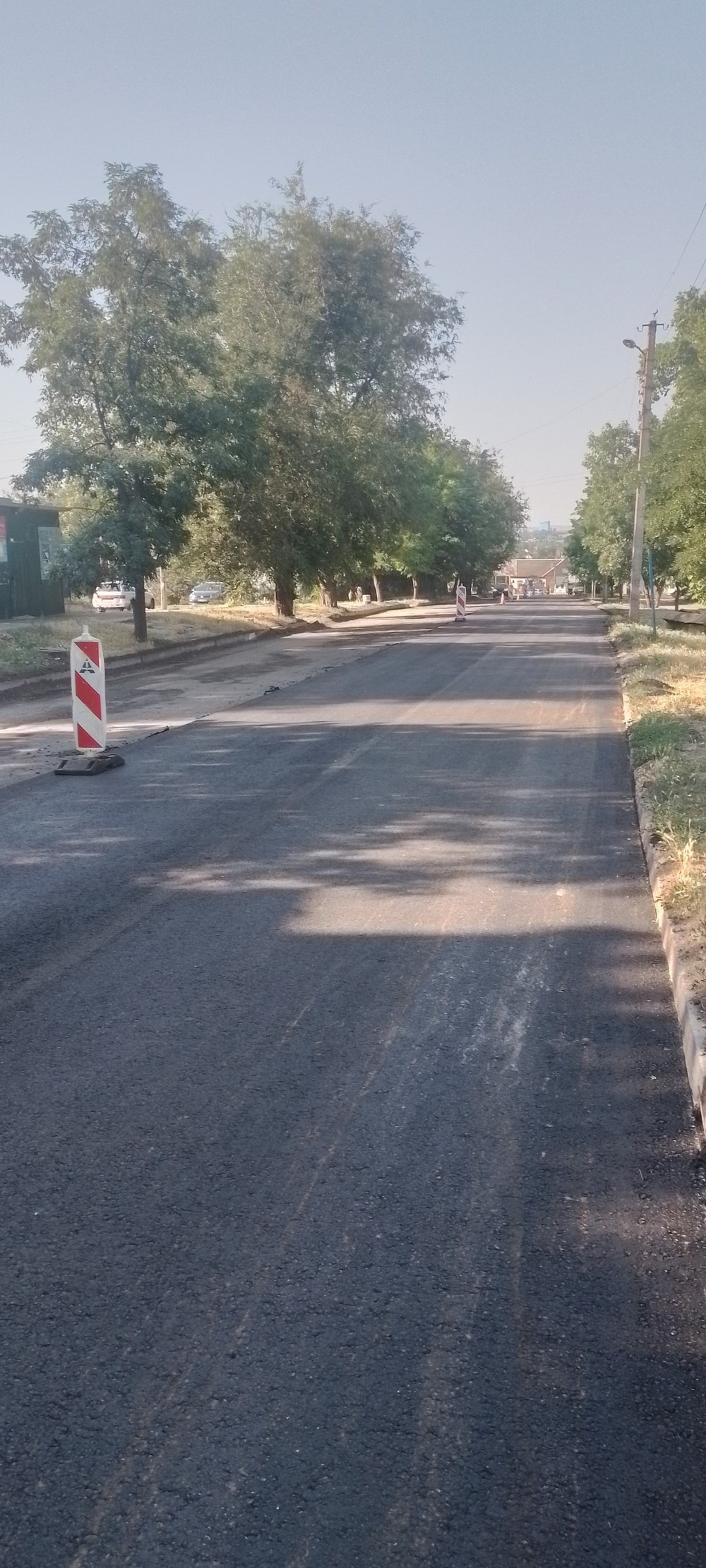 У Томаківці розпочали укладання нового асфальтобетонного покриття: звернення до водіїв
