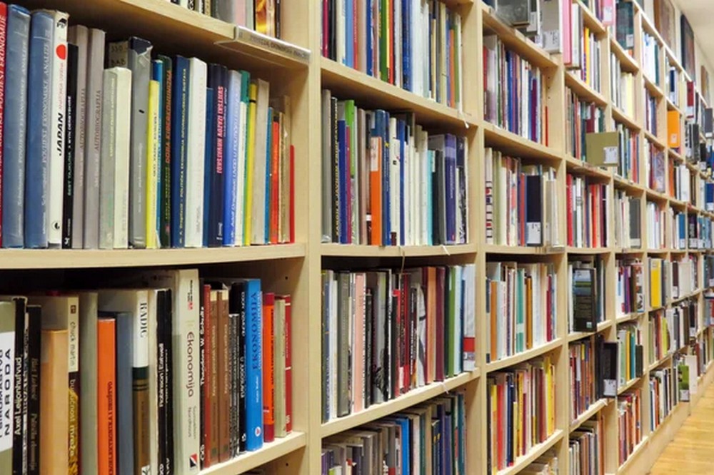 depositphotos 10525865 stock photo bookshelf in library with many